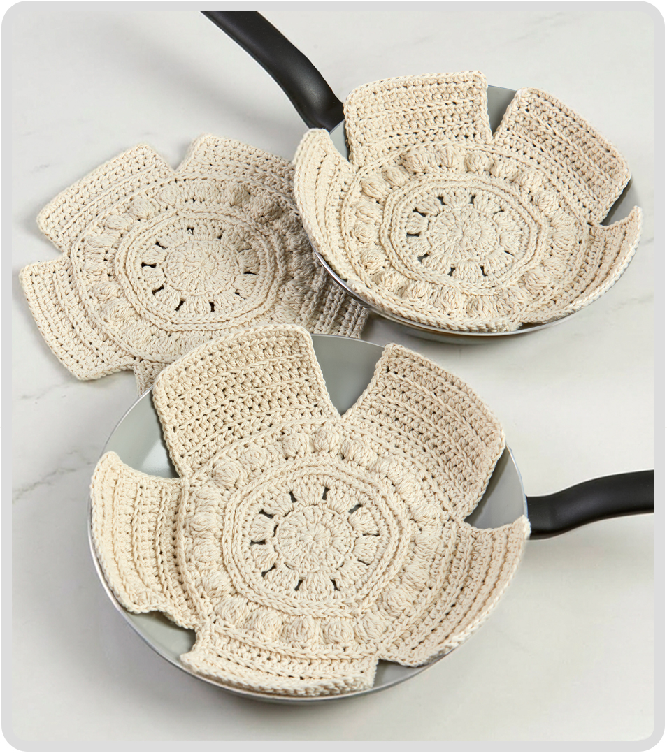 Three decorative crocheted pan protectors